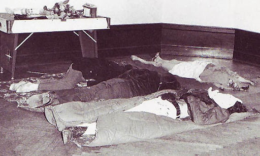 The bodies of Helen, Patricia, Frederick, and John Jr. List in the ballroom of Breeze Knoll. They were placed just inside the doorway, of the right-hand side, near the grand fireplace in the ballroom. Helen is in her nightgown and slippers; the children all still have their outerwear on.
